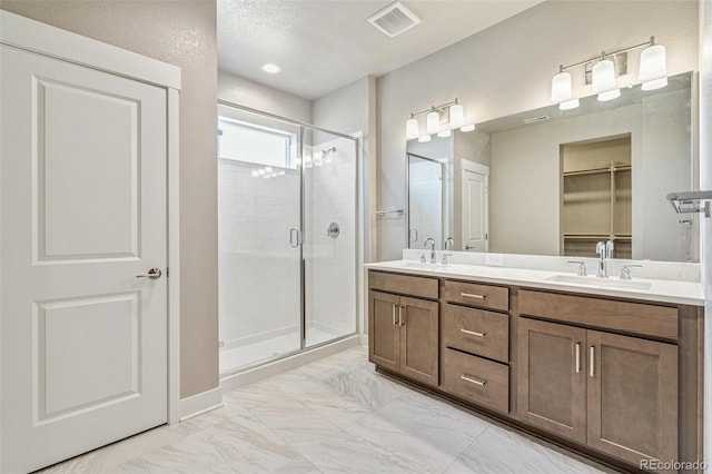 21022 E 63rd Dr, Aurora, CO 80019 - bathroom featuring vanity and a shower with door
