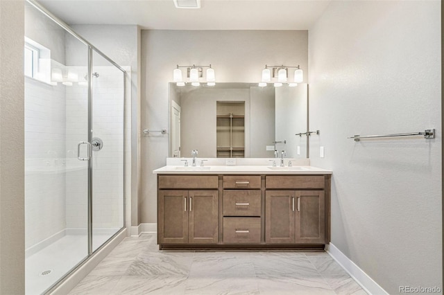 21022 E 63rd Dr, Aurora, CO 80019 - bathroom with vanity and a shower with door
