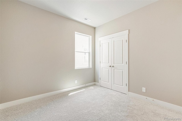 21022 E 63rd Dr, Aurora, CO 80019 - unfurnished bedroom featuring a closet and carpet