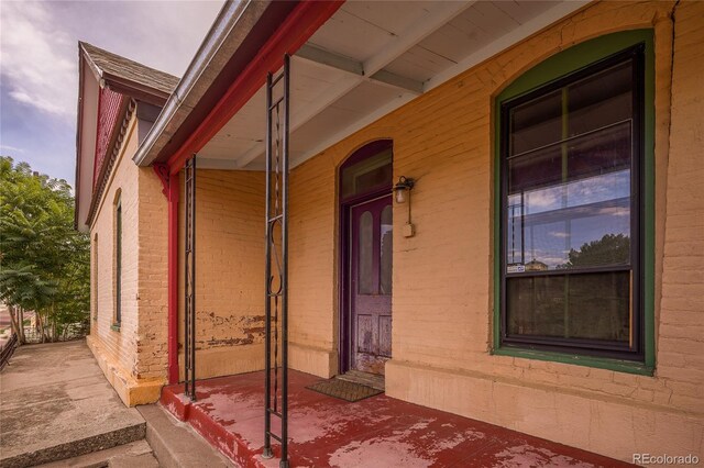 view of property exterior with a porch