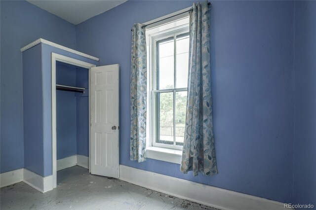 unfurnished bedroom with a closet