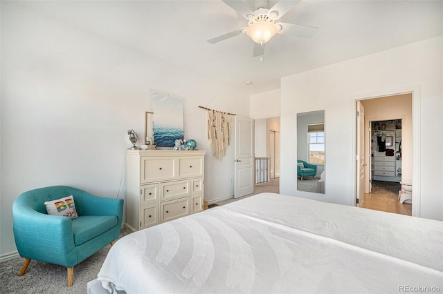 bedroom with ceiling fan and carpet floors