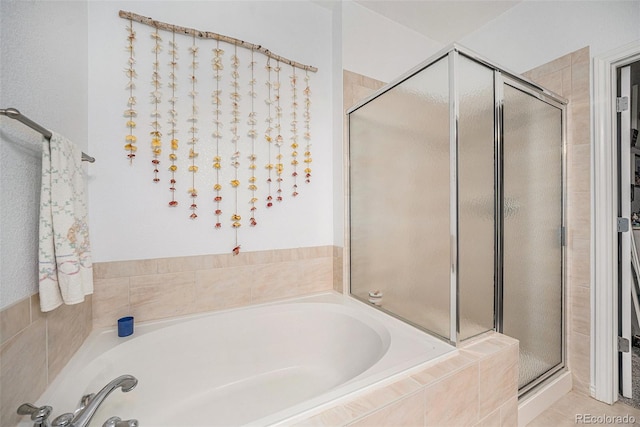 bathroom with plus walk in shower and tile patterned flooring