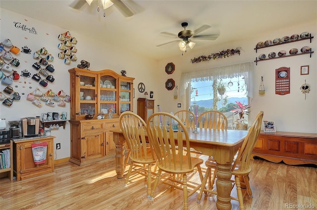 dining area featuring light wood-type flooring and ceiling fan