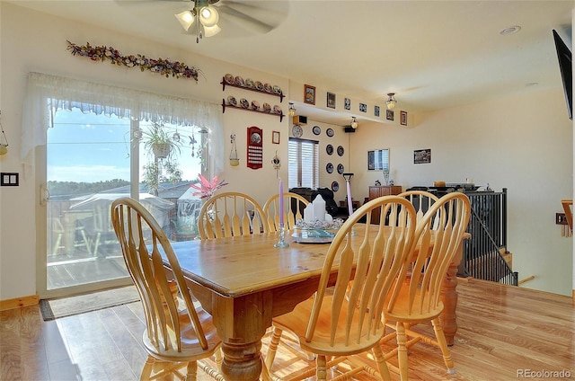 dining area featuring light wood-type flooring and ceiling fan