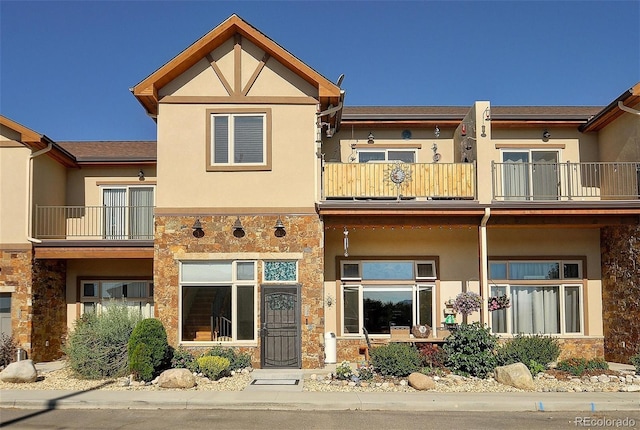 123 Halleys Ave Unit C, Poncha Springs, CO 81242 - back of property with a balcony, stone siding, and stucco siding
