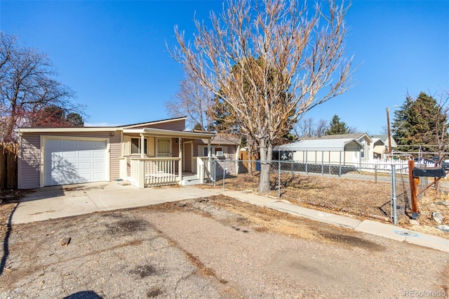 ranch-style home featuring concrete driveway, a porch, an attached garage, and fence