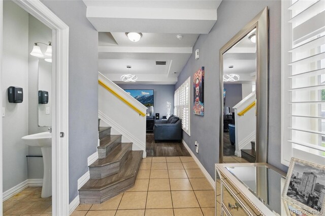 18619 E 50th Pl, Denver, CO 80249 - entryway featuring stairway, light tile patterned floors, and baseboards