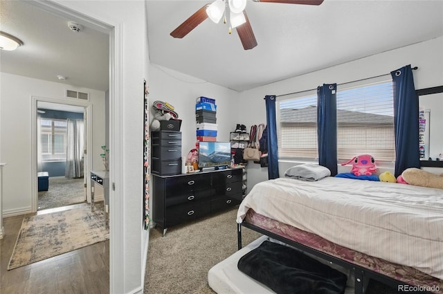 18619 E 50th Pl, Denver, CO 80249 - bedroom with a ceiling fan, wood finished floors, and baseboards