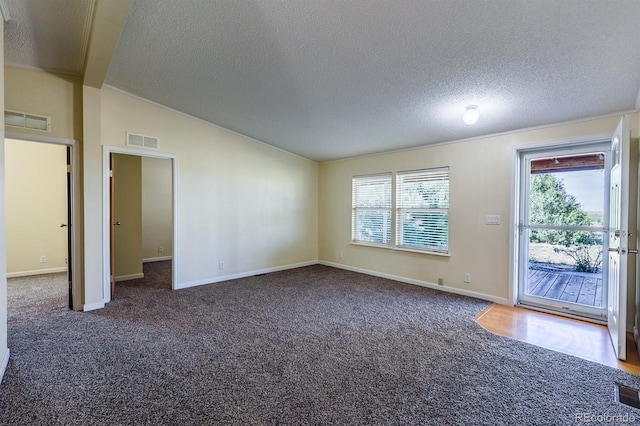 39045 Big Springs Rd, Rush, CO 80833 - empty room featuring lofted ceiling, carpet, a textured ceiling, and baseboards