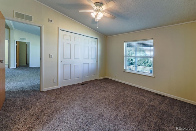 39045 Big Springs Rd, Rush, CO 80833 - unfurnished bedroom with carpet floors, ornamental molding, vaulted ceiling, a textured ceiling, and baseboards