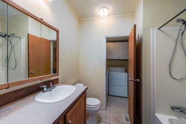 39045 Big Springs Rd, Rush, CO 80833 - bathroom featuring vanity, washer and dryer, toilet, ornamental molding, and shower / washtub combination