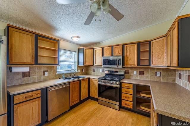 39045 Big Springs Rd, Rush, CO 80833 - kitchen with open shelves, appliances with stainless steel finishes, a sink, a textured ceiling, and crown molding