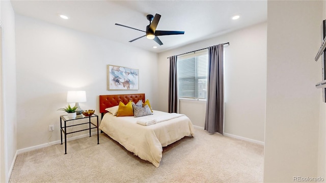 bedroom featuring ceiling fan and light colored carpet