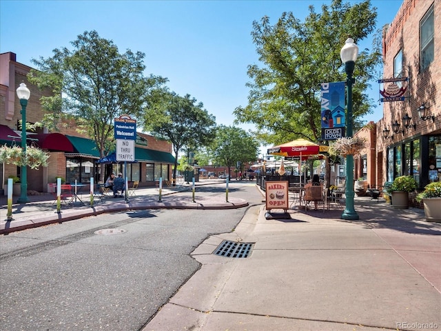 11165 W 58th Ave, Arvada, CO 80002 - view of asphalt road with street lights, sidewalks, curbs, and traffic signs