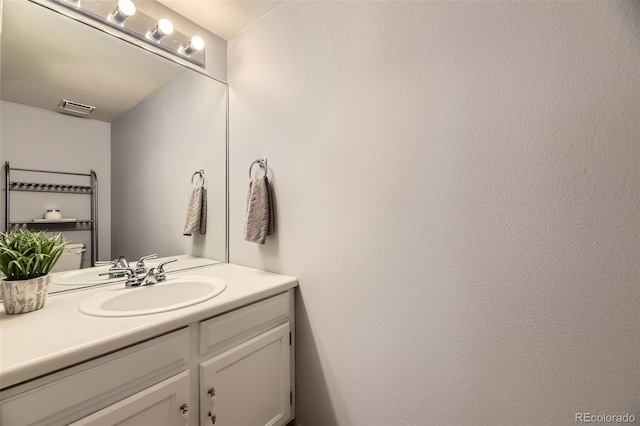 bathroom with visible vents and vanity