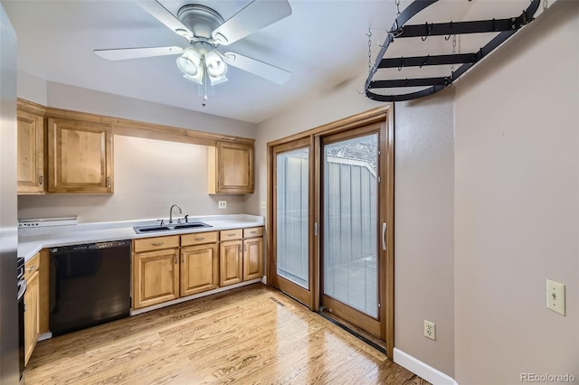 7721 S Curtice Way Unit B, Littleton, CO 80120 - kitchen with black dishwasher, a sink, light wood-style floors, light countertops, and ceiling fan