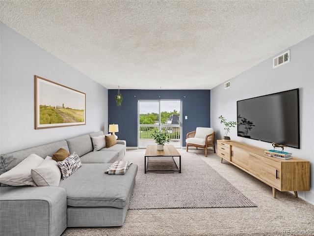 190 E Highline Cir Unit 302, Centennial, CO 80122 - living room featuring carpet floors and a textured ceiling