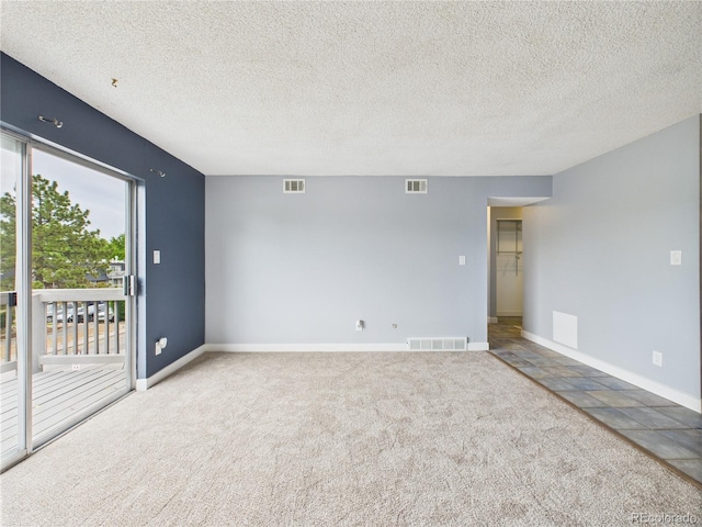 190 E Highline Cir Unit 302, Centennial, CO 80122 - spare room featuring carpet floors, baseboards, and a textured ceiling