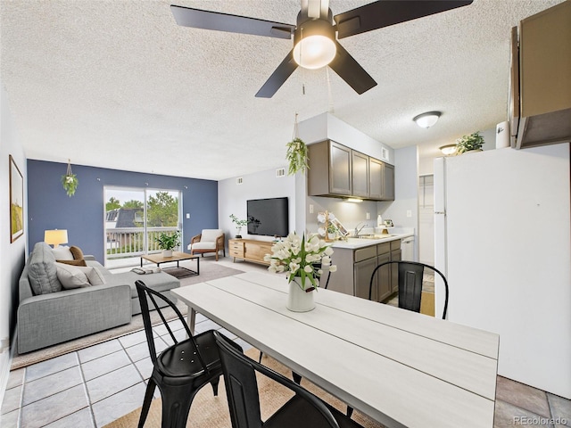 190 E Highline Cir Unit 302, Centennial, CO 80122 - dining space featuring a textured ceiling, light tile patterned flooring, and ceiling fan