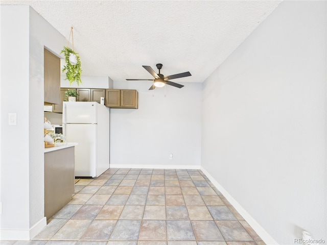 190 E Highline Cir Unit 302, Centennial, CO 80122 - unfurnished living room with ceiling fan, a textured ceiling, baseboards, and light stone finish flooring