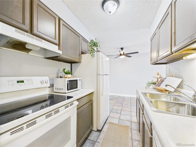 190 E Highline Cir Unit 302, Centennial, CO 80122 - kitchen featuring white appliances, under cabinet range hood, a sink, a ceiling fan, and light countertops