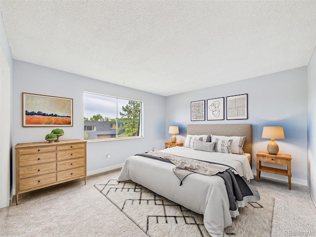 190 E Highline Cir Unit 302, Centennial, CO 80122 - bedroom featuring carpet floors, baseboards, and a textured ceiling