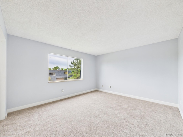 190 E Highline Cir Unit 302, Centennial, CO 80122 - unfurnished room featuring carpet, a textured ceiling, and baseboards