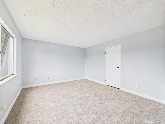 190 E Highline Cir Unit 302, Centennial, CO 80122 - carpeted empty room with a textured ceiling and baseboards