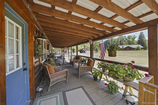 wooden terrace featuring an outdoor hangout area