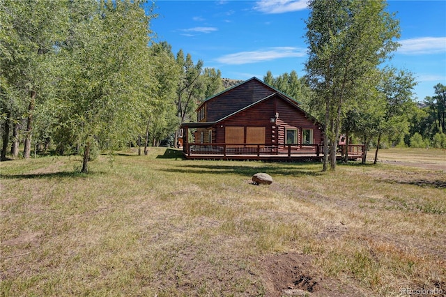 view of yard with a wooden deck