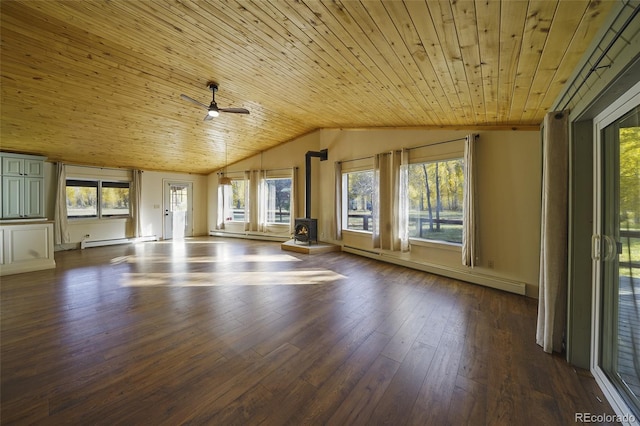 interior space with a wood stove, a wealth of natural light, and wooden ceiling