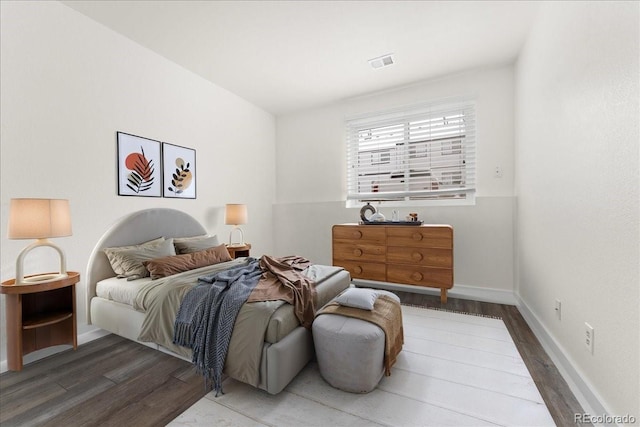 bedroom with hardwood / wood-style floors