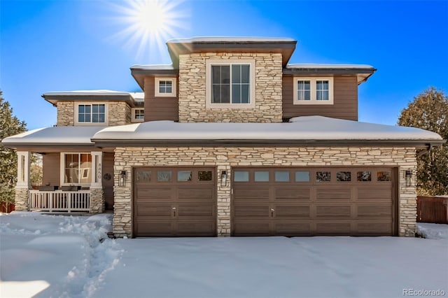 prairie-style home with a garage and covered porch