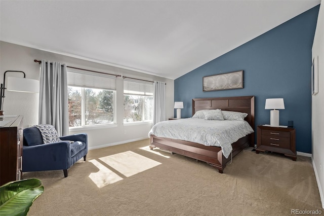 bedroom featuring lofted ceiling, carpet flooring, and baseboards