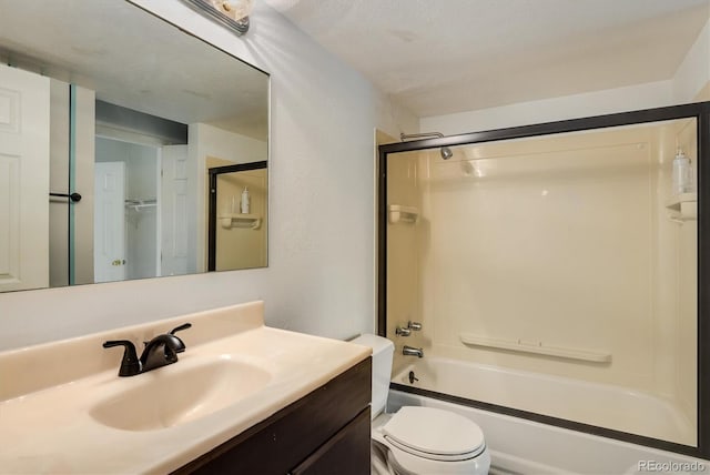 bathroom with toilet, vanity, and washtub / shower combination