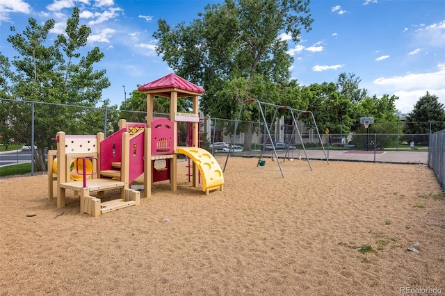community jungle gym featuring fence
