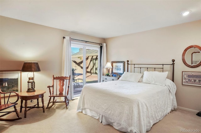 carpeted bedroom featuring access to outside