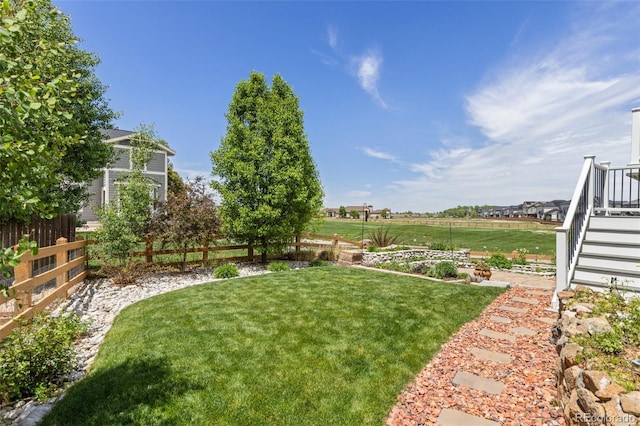 view of yard featuring stairs