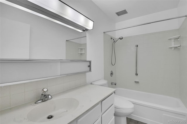 9655 E Center Ave Unit 9D, Denver, CO 80247 - bathroom featuring vanity, decorative backsplash, and shower / bathtub combination