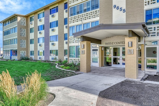 9655 E Center Ave Unit 9D, Denver, CO 80247 - entrance to property with a yard and french doors