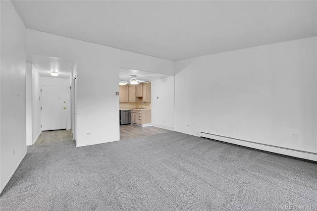9655 E Center Ave Unit 9D, Denver, CO 80247 - unfurnished living room featuring a baseboard radiator, light carpet, and ceiling fan