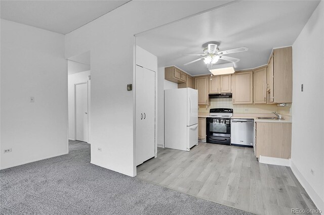 9655 E Center Ave Unit 9D, Denver, CO 80247 - kitchen with freestanding refrigerator, electric stove, dishwasher, light countertops, and under cabinet range hood