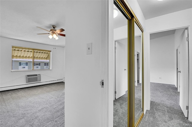 9655 E Center Ave Unit 9D, Denver, CO 80247 - hallway with carpet and a wall unit AC