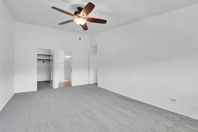 9655 E Center Ave Unit 9D, Denver, CO 80247 - unfurnished bedroom featuring carpet floors, a spacious closet, and ceiling fan