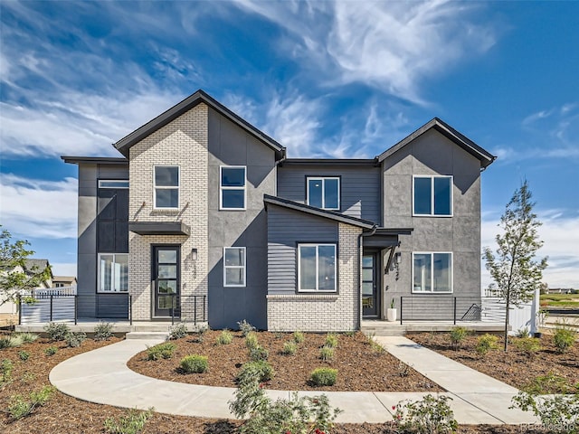1222 S Algonquian St, Aurora, CO 80018 - modern home featuring brick siding and stucco siding