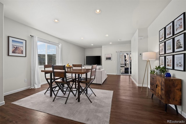 dining space featuring dark hardwood / wood-style flooring