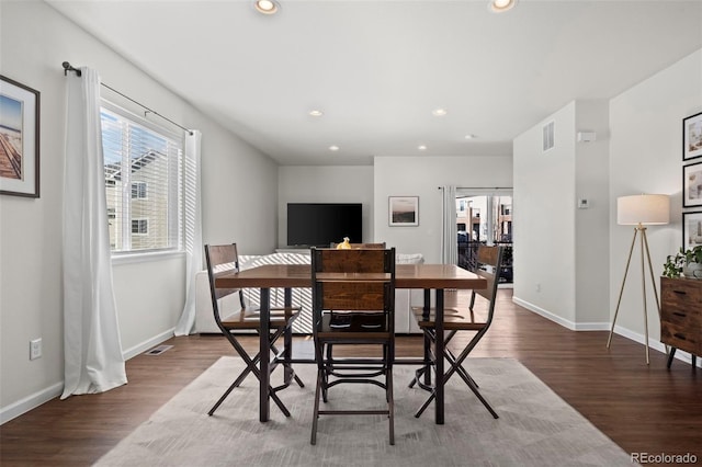 dining space with dark wood-type flooring