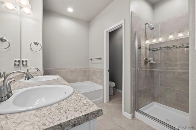 full bathroom with tile patterned floors, vanity, toilet, and plus walk in shower