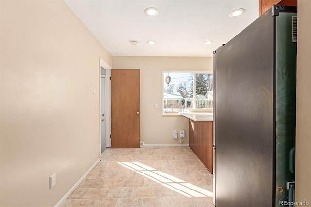 interior space with recessed lighting, vanity, and baseboards